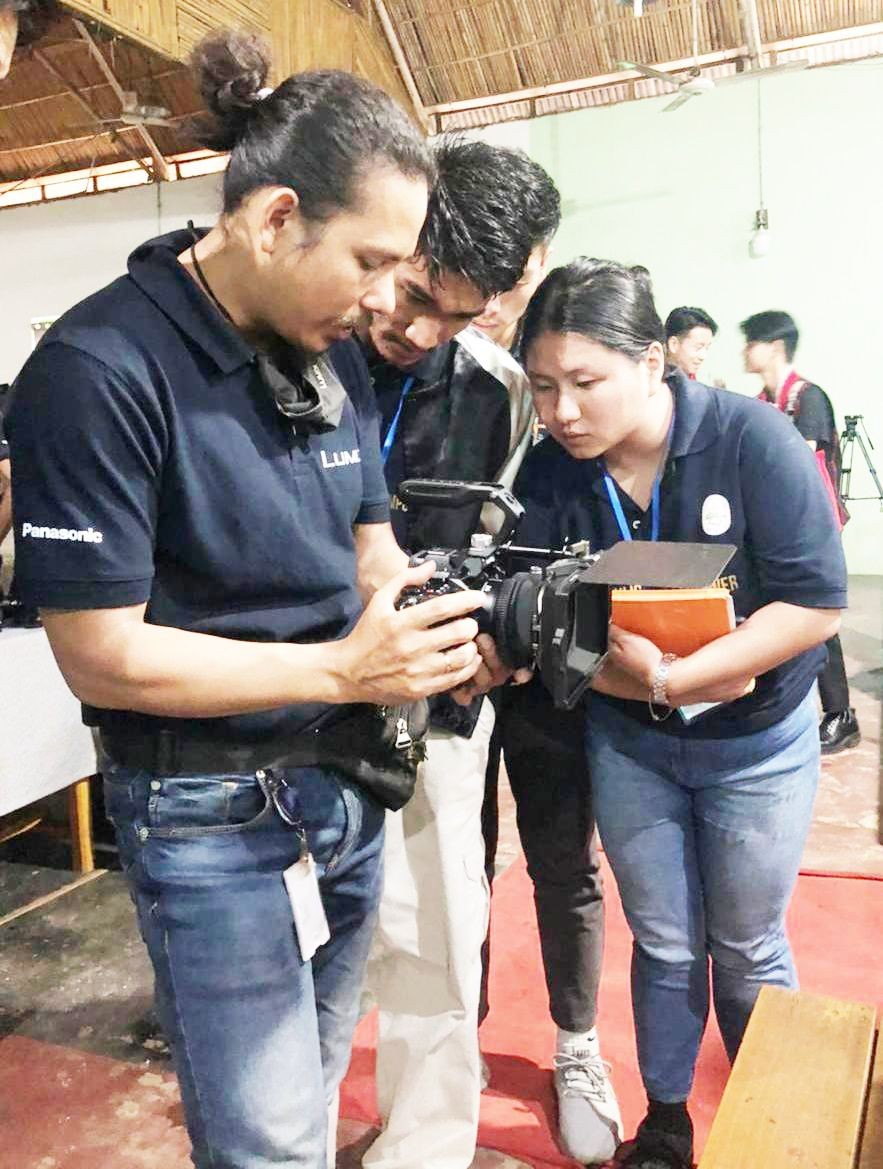 Students learn aspects of camera operation during a Filmmaking workshop held at Patkai Christian College (Autonomous) on November 3. (Morung Photo)